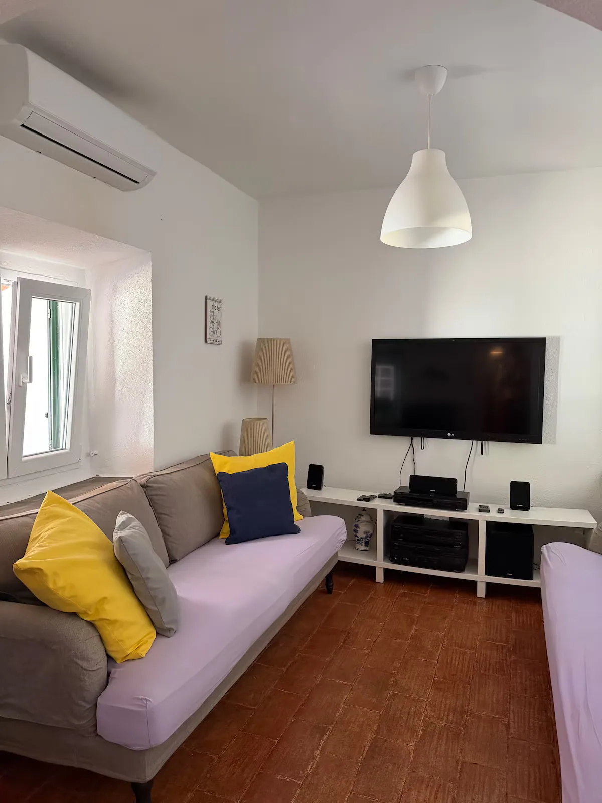 Sitting room with sofa and television
